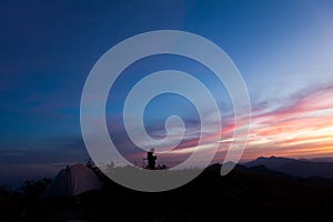 Unrecognized people using a celular smartphone in a mountain landscape
