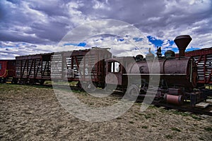 An unrestored steam train and old rail car in South Dakota