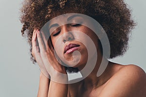 Unretouched close up photo of girl with closed eyes feel self body esteem  grey color background