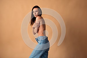 Unretouched photo of girl wear oversize denim cover breast feel