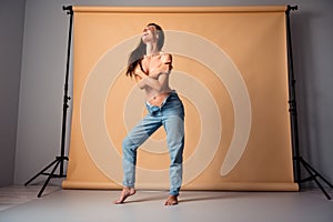 Unretouched photo of happy girl body positive feeling tenderness hug self chest on photo session  studio