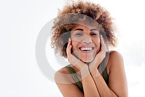 Unretouched portrait of latin girl touch face enjoy soft imperfect skin  light studio background