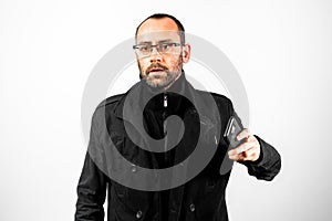 Unretouched portrait of man holding a smartphone with his hand