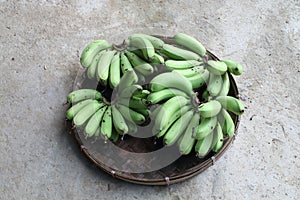 Unripe banana in pannier