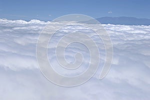 unrise above clouds from airplane window