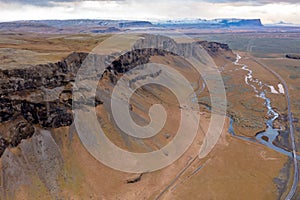 Unrivaled views of Icelandic deep canyon with moss, volcanic rocks and mountain river. Tourism photo