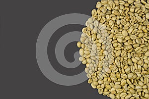 Unroasted coffee beans isolated on grey background