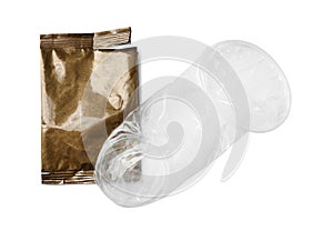 Unrolled female condom and torn package isolated on white, top view. Safe sex