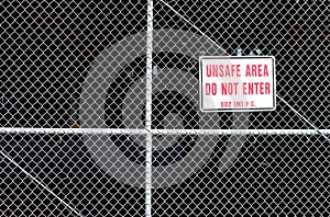 Unsafe area behind a fence with do not enter.