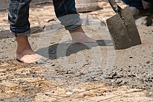 Unsafe construction of Myanmar migrant workers while pouring concrete slab in construction site , Thailand