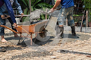 Unsafe construction of Myanmar migrant workers while pouring concrete slab in construction site , Thailand