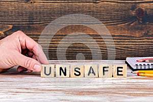 Unsafe. Wooden letters on the office desk