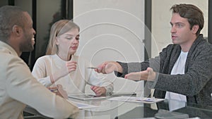 Unsatisfied Man in Argument with Teammates