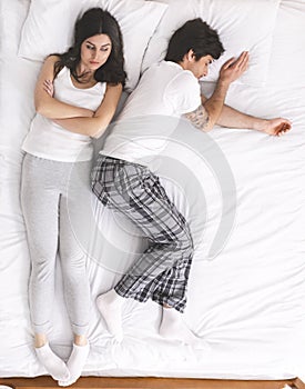 Unsatisfied woman can`t sleep because of her boyfriend