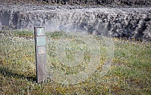 Unsecure cliff warning sign at a site in Iceland