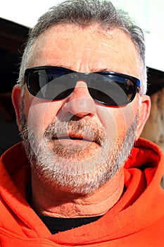 Unshaven Laborer Wearing Sunglasses