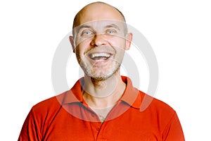Unshaven laughing middle-aged man in a red T-shirt. Studio. isol