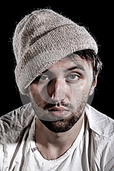 Unshaven man in a knitted hat