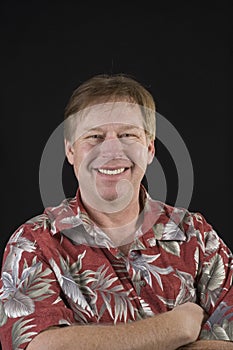 Unshaven middle aged man in floral shirt man photo