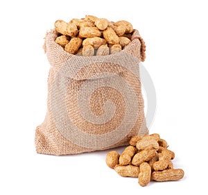 unshelled peanuts in sack bag isolated on white background close up