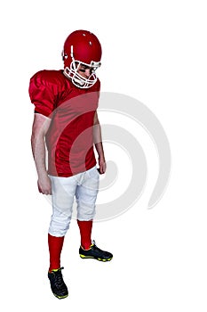Unsmiling american football player looking down