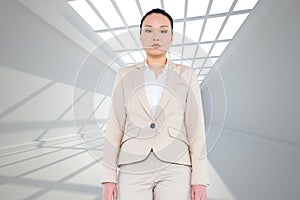 Unsmiling asian businesswoman walking