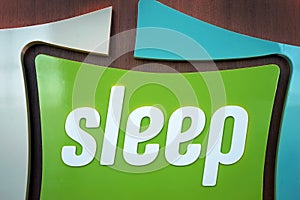 Unspecified universal Sleep sign of plastic letters on wooden background
