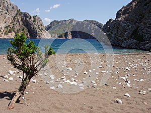 An unspoiled beach sand, sea and silence