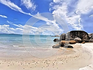 Unspoiled beach views with piles of large rocks