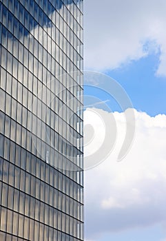 Unstable reflections of clouds on the windows of a builduing