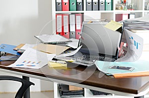 Untidy and cluttered desk