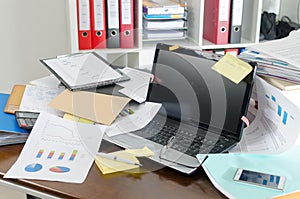 Untidy and cluttered desk