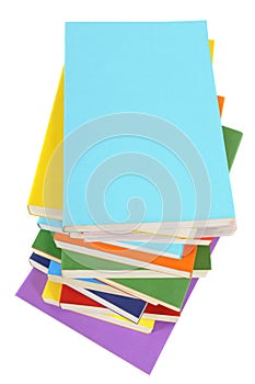 Untidy stack of books, top view, vertical, isolated on white background, copy space