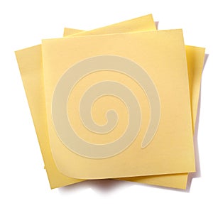 Untidy stack yellow sticky post notes isolated on white background