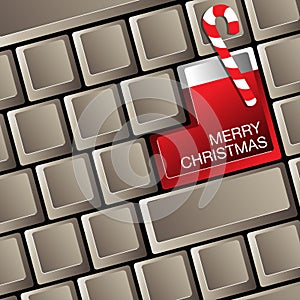 A Merry Christmas computer keyboard with stocking.