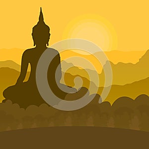 Black silhouette of a Buddha sitting on a mountain