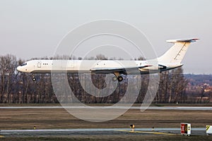 Untitled airplane. Cargo plane. Aircraft without title at airport. Aviation theme. In flight. Landing and arrival.