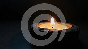 Tealight Candle in Dark Stone Holder with Soft Ambient Glow