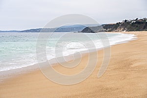 Untouched sand by the sea at empty beach in Algarrobo photo