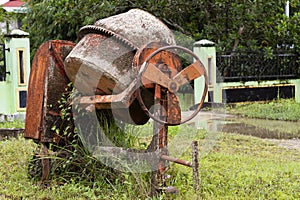 Untreated, rusty and unusable cement mixer