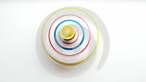 Untwisted whirligig, children toy spinning top spinning on white background.View from top.