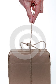 Untying string on package