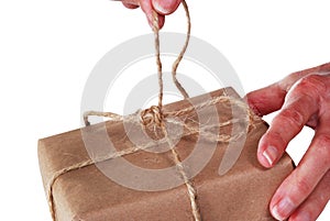 Untying string on package