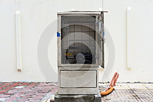 Unused electric cabinet on sidewalk in Hanoi