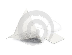 Unused pyramid tea bag with tag on white
