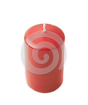 Unused red wax candle isolated