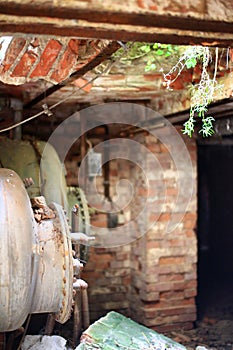 Unused storage tanks in basement of an abandoned building