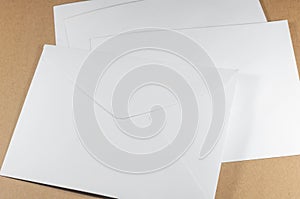 Unused white envelope on brown background