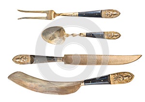 Unusual Antique Arabic Cutlery gold isolated on white background. Fork, spoon and two knives. Antique silverware.