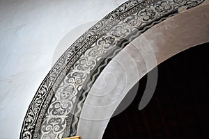 Unusual arch decorated by skull in San Antonio church in Frigiliana - Spanish white village Andalusia photo